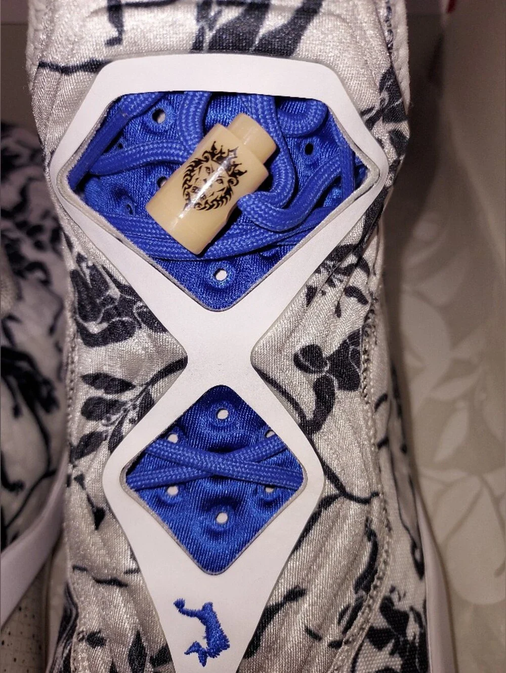 Nike Men’s White Floral Training Shoes with Black Print and Blue Details